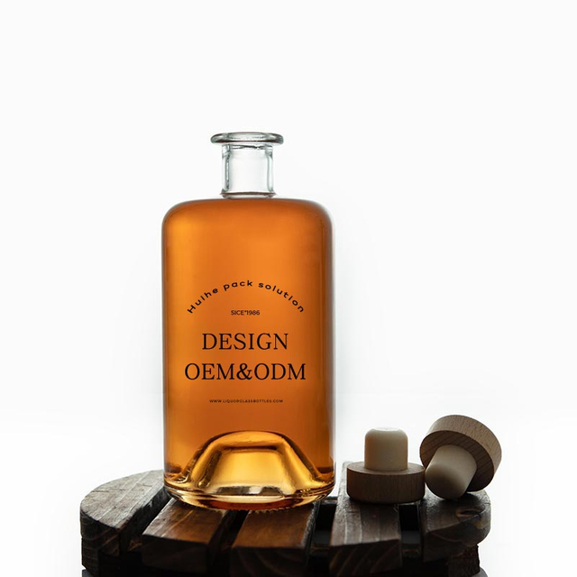 Botella de licor de vidrio de herbalista redondo