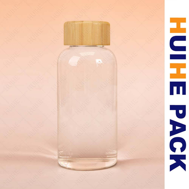 Botella de agua de vidrio de borosilicato transparente personalizada con tapa de bamb&uacute;
