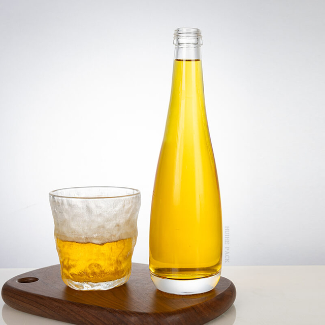 Cuerpo bulboso Botella de licor de vidrio de cuello delgado largo al por mayor