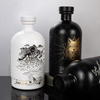 Patrones únicos de estampado caliente botella de licor de vidrio de hombro redondo