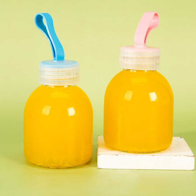 La mano port&aacute;til 250ml 8oz de la cuerda de la manija presion&oacute; la botella de cristal del jugo