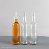Botella de whisky escocés de vidrio de pedernal transparente redonda al por mayor de 720 ml
