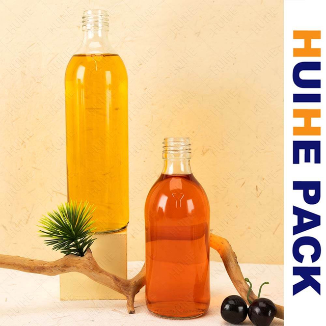 China Botella de Kombucha de vidrio alta con cilindro de 300 ml y 500 ml Fabricantes