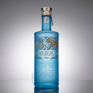 Letras elevadas botella de licor de vidrio de cilindro texturizado