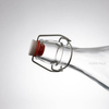 Botella de bebida potable de agua de vidrio transparente de 1000 ml con tapa abatible