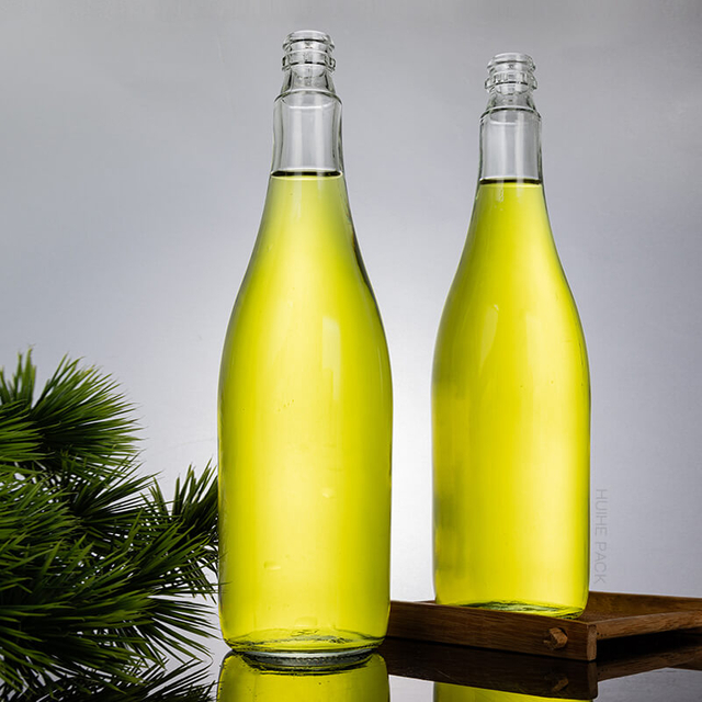 Botella de bebida de jugo de fruta de vidrio a granel de 785 ml con tapa de corona