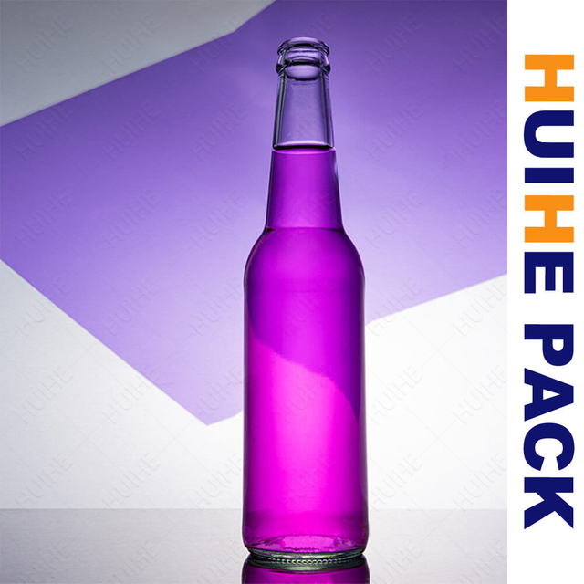 Botella de bebida espumosa de vidrio cil&iacute;ndrica de 650 ml con tapa de corona