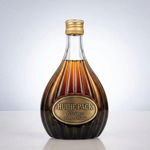 Botella de licor de vidrio en forma de pera con patrones de acanalado vertical